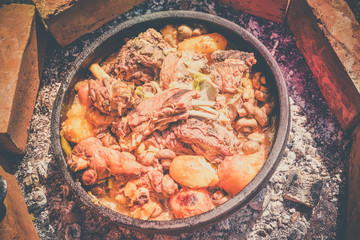 Lamb meat, potatoes and vegetables cooked on a grill, Serbian dish 