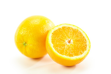 orange whole and half on white background