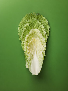 Leaves of cabbage on green