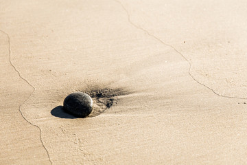 Fototapeta na wymiar pebble in the sand