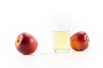 two apples and a glass of apple juice