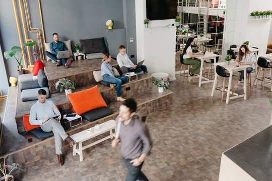 People working separately in the co-working office space