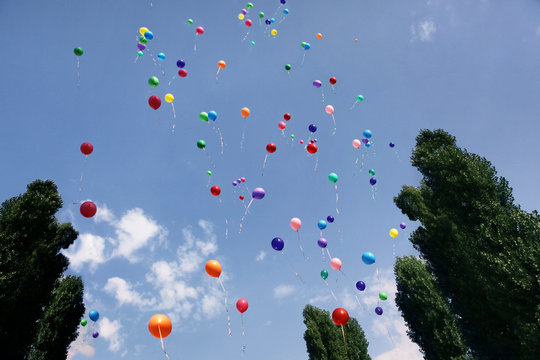 Multicolored balls flying up into the sky