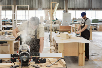 Carpenter Using Woodworking Machine