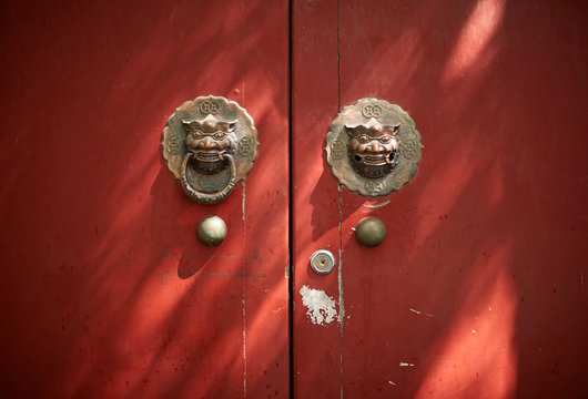 Aged old mahogany door in the alley of Beijing
