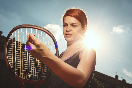 Young Woman Concentrated Before Tennis Match