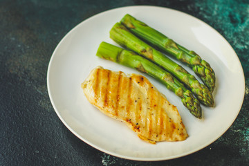 asparagus and chicken meat, breast fillets grill, hollandaise sauce. food background. top