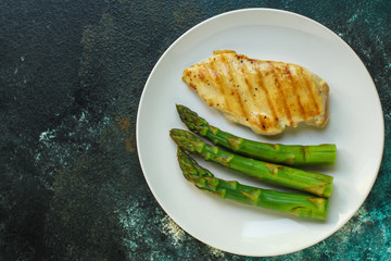 asparagus and chicken meat, breast fillets grill, hollandaise sauce. food background. top