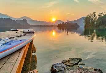 paddle boarding around Bled lake in the morning
