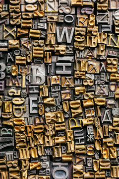 Dusty old metal letterpress type pieces background