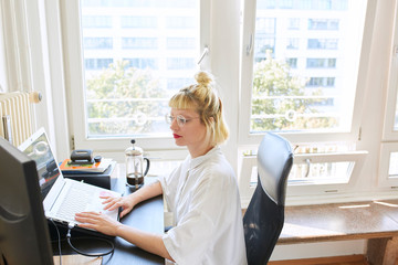 Woman typing on her laptop