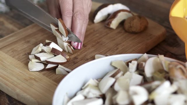 Woman slicing mushrooms