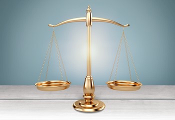 Law scales on table background. Symbol of justice