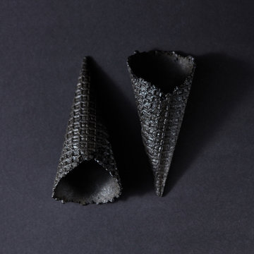 Creative black pattern with two black wafer cones for ice cream