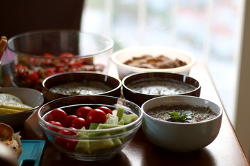 Table setting with galette, snacks, dips and salads. Selective focus.