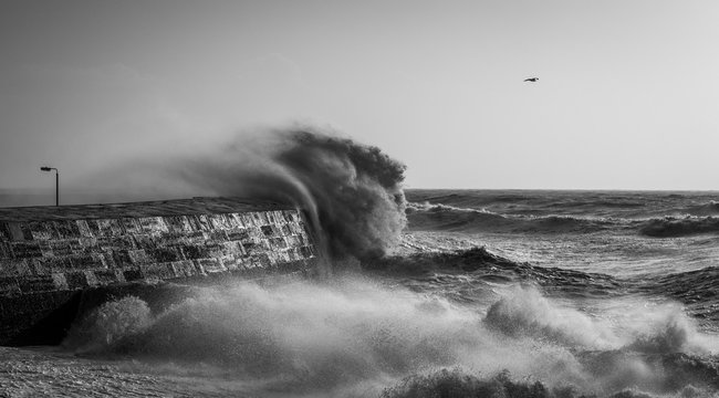 A a monochrome stormy sea with crashing waves