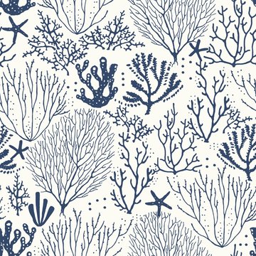 Seamless hand drawn pattern with coral reef and starfishes. Vector dark blue illustration on ivory background.