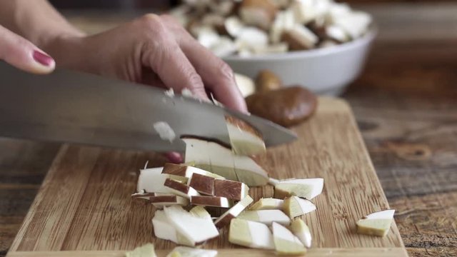 Woman slicing mushrooms