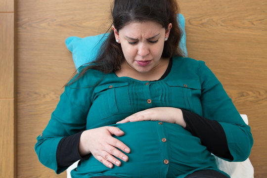 Pregnant Woman Experiencing a Painful Contraction