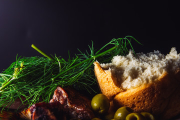 grilled pork ribs and bread on wooden table