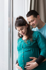 Expectant Parents Holding Growing Baby Bump