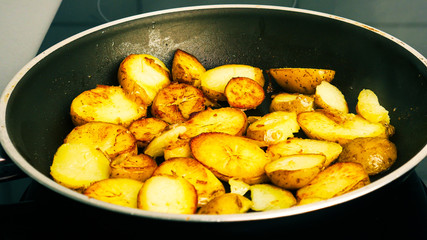 Close up. Potatoes in a frying pan fried in butter. Food concept