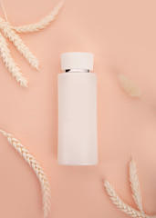 cosmetic tube for the promotion of foundation premium product. Colorstay make-up in bottle and tube on a soft beige background