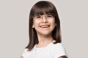 Funny little girl wearing glasses with round big spectacle frame
