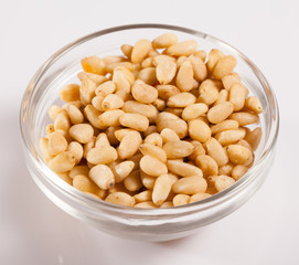Glass bowl with pine nuts