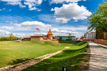 Fototapeta na wymiar Historical gothic Kaunas Castle from medieval times in Kaunas, Lithuania. Wide angle panoramic view on cloudy sky background