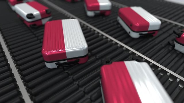 Many travel suitcases featuring flag of Poland on roller conveyer. Polish tourism conceptual animation
