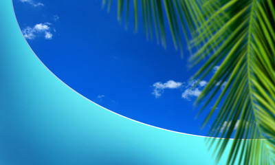 Fototapeta na wymiar close up green palm tree leaf and textured empty blue wall over sunny blue sky