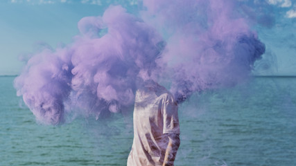 Man holding smoke bomb
