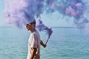 Man holding smoke bomb