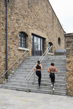 Fit runners going upstairs for training.