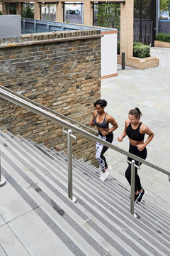 Fit runners going upstairs for training.
