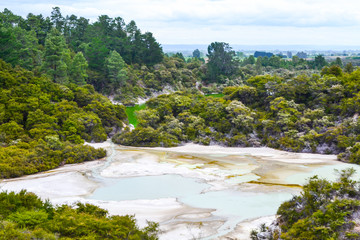View of colorful steaming volcanic Champagne pool in geothermal Wai-O-Tapu wonderland in Rotorua, North Island, New Zealand. Tourist popular unique natural attraction. 