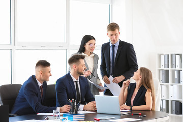 Team of business people during meeting in office