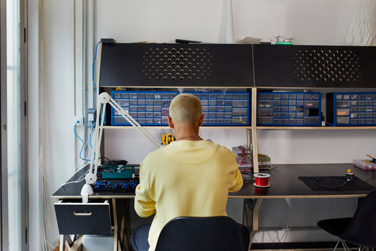Engineer Working At Desk In University