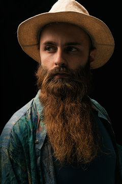 Young man with beard looking at camera