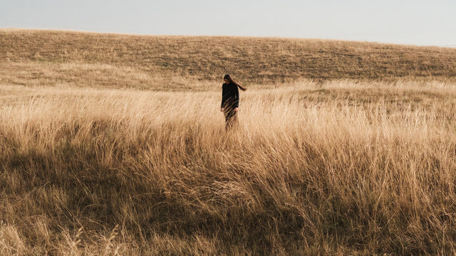Wide Shot Of A Woman In The Prairie