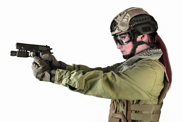 Beautiful fully equipped military soldier woman aiming at the enemy with pistol, isolated photo.