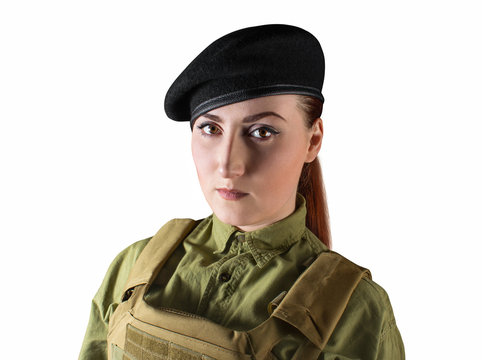 Portrait of young beautiful soldier woman in miliary beret and protective armor tactical vest, isolated photo.