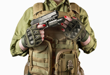 Military soldier woman's hands holding a gun.