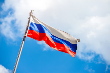 Russian flag fluttering on a metal flagpol