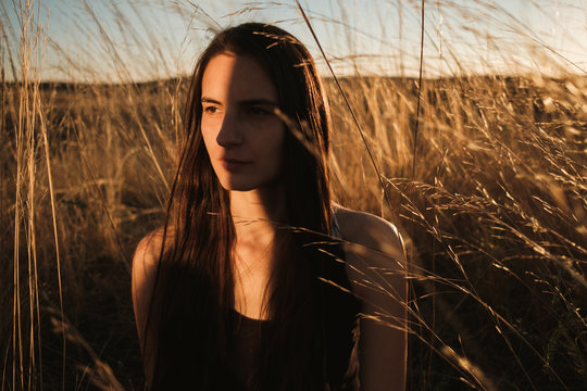 Close Up Of A Mysterious Brunette Woman During Sunset