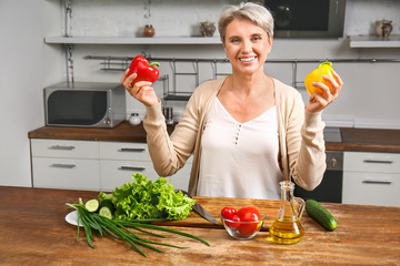 Mature woman cooking in kitchen