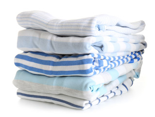 Stack of modern clothes on white background