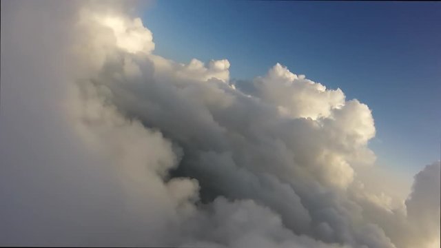 POV Flight While Banking In The Clouds.