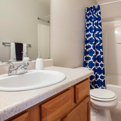 Square Small bathroom interior with a vanity unit and toliet against the white wall